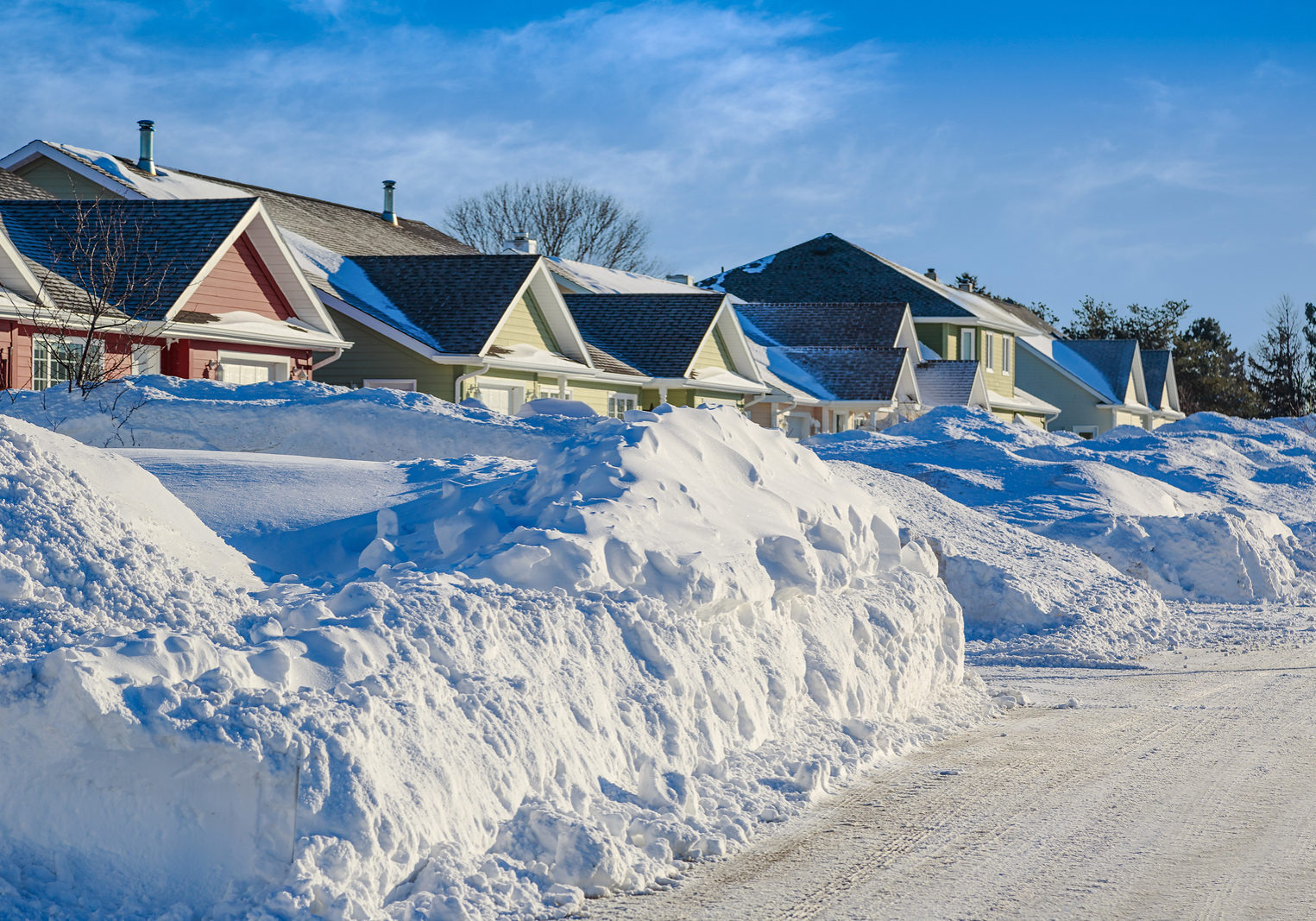 Homes in a North American suburb after a snow storm. SNOW REMOVAL & DUMPING